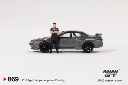 【2025年2月以降発売予定】 MINI GT MGT00869-R 1/64 Nissan スカイライン GT-R R32 ニスモガンメタル  松田次生コレクション w/ 松田次生氏フィギュア(右ハンドル)